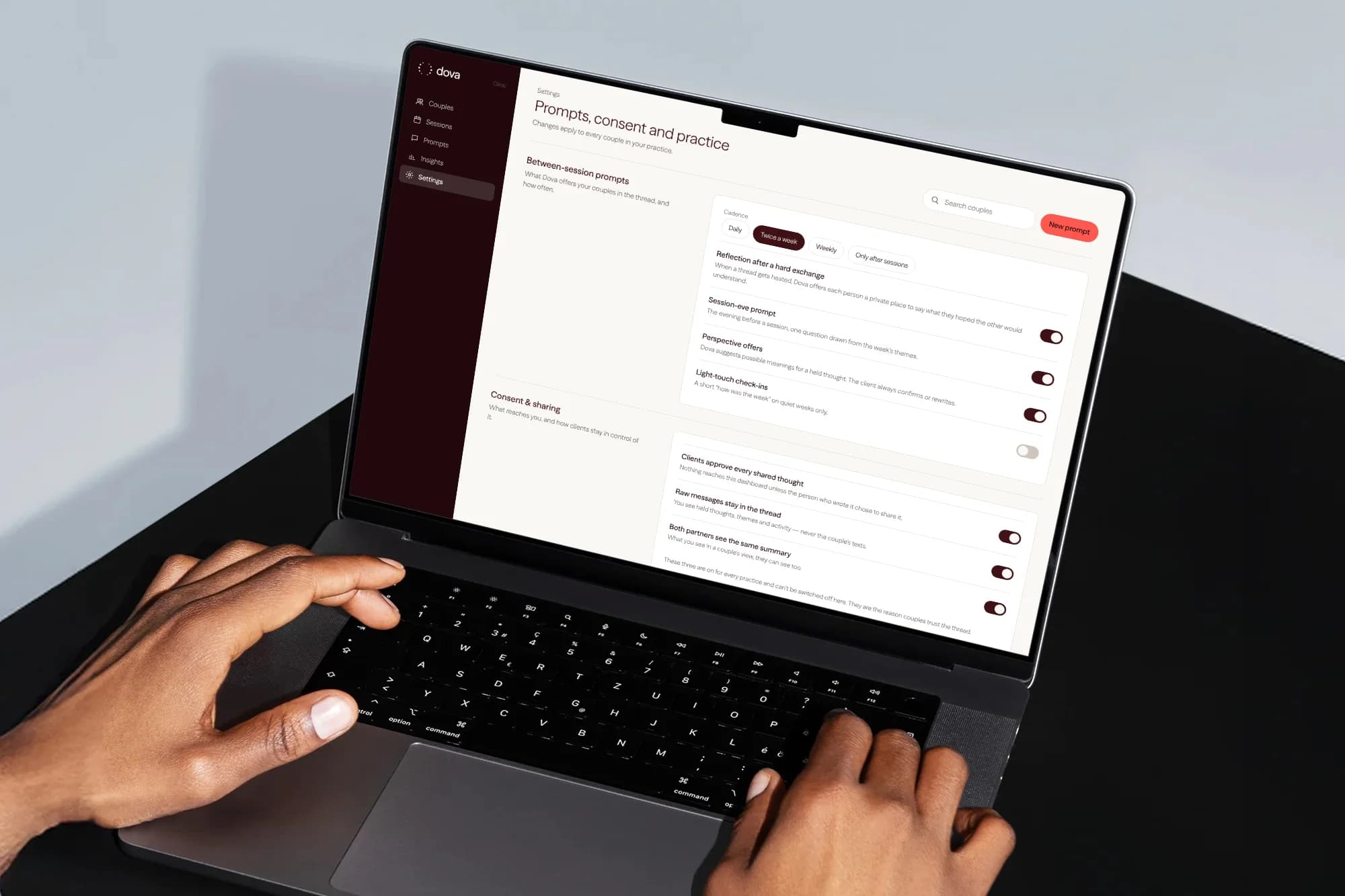 Hands on a laptop showing Dova’s settings: between-session prompts, consent and sharing