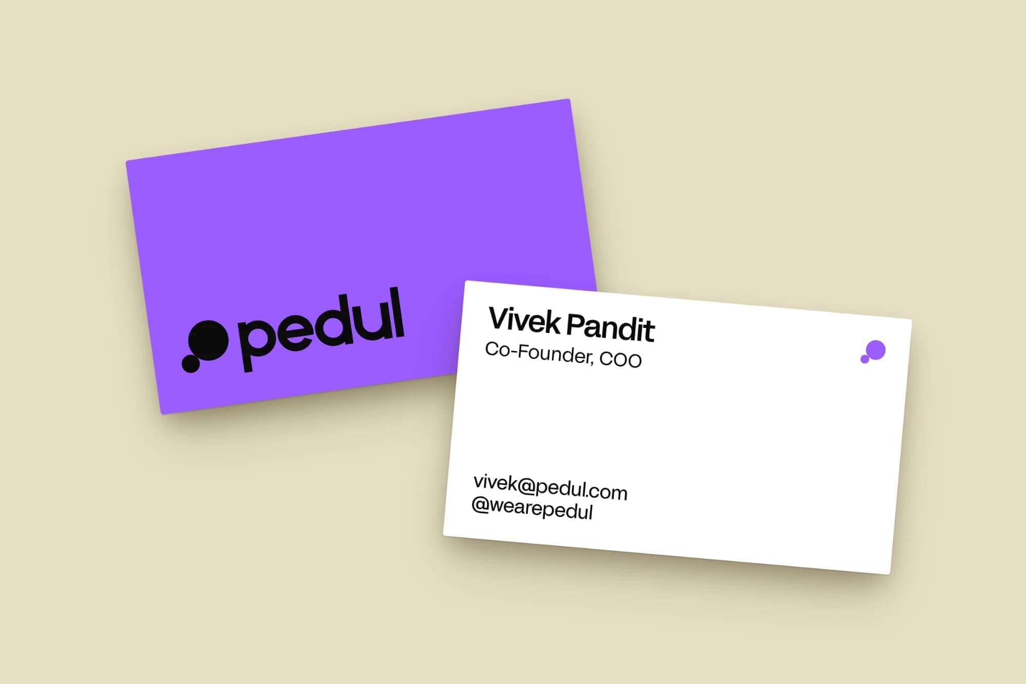 pedul business cards in violet and white on sand